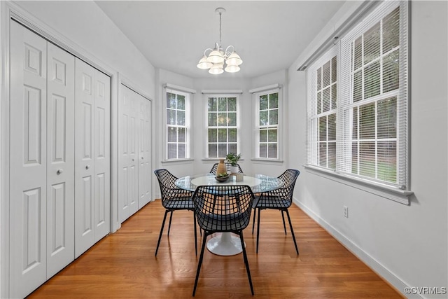 11324 Regalia Dr, Chesterfield, VA 23838 - dining area featuring a chandelier, light wood-type flooring, and baseboards