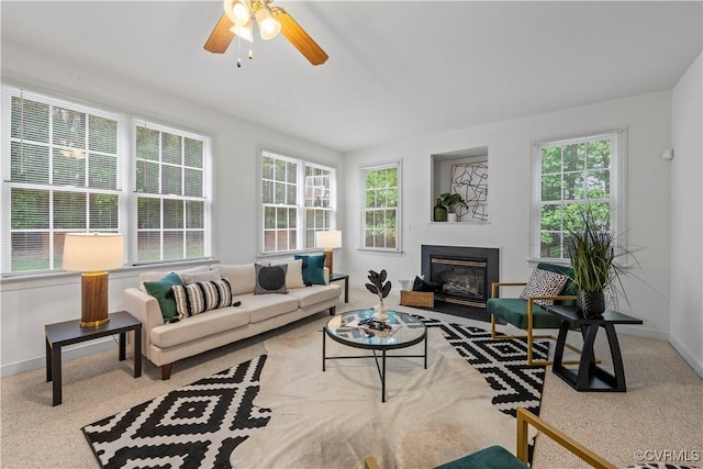 11324 Regalia Dr, Chesterfield, VA 23838 - carpeted living room with healthy amount of natural light, baseboards, and a fireplace with flush hearth