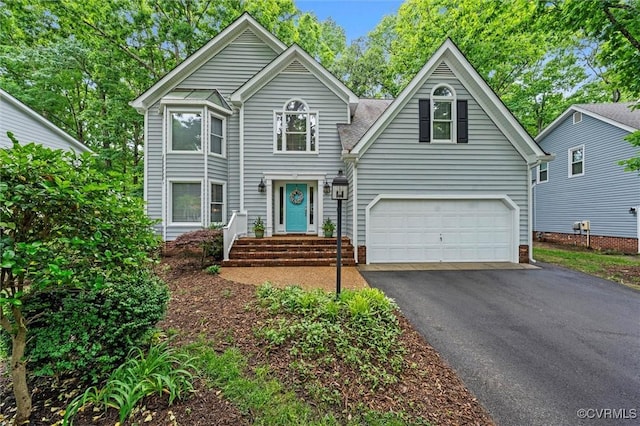 view of front facade with driveway and an attached garage