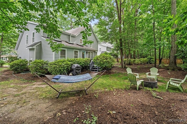 view of yard with a fire pit