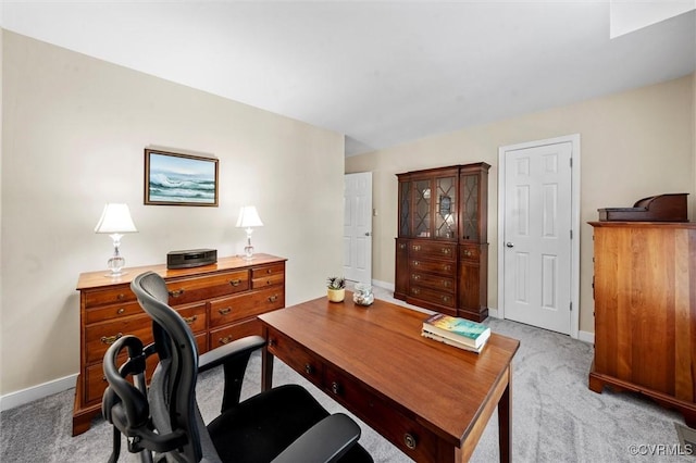 office area with light colored carpet and baseboards