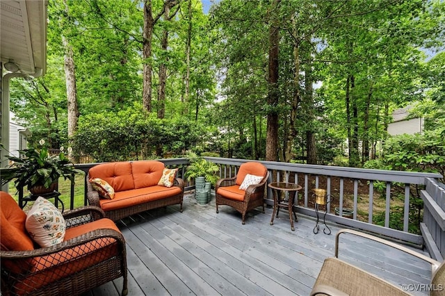wooden deck featuring outdoor lounge area