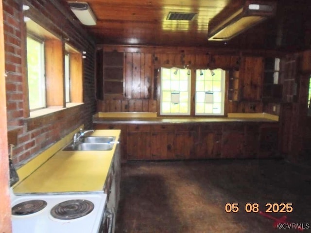 3740 Turner Rd, Richmond, VA 23832 - kitchen with a sink, electric range oven, light countertops, and brick wall