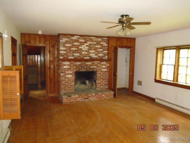 3740 Turner Rd, Richmond, VA 23832 - unfurnished living room with ceiling fan, a baseboard heating unit, a brick fireplace, and baseboards