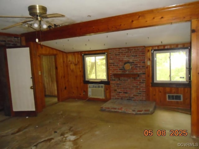 3740 Turner Rd, Richmond, VA 23832 - unfurnished living room featuring a wall unit AC, ceiling fan, beam ceiling, and wood walls
