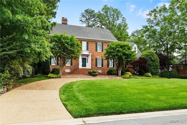 11458 Barrington Bridge Ct, Henrico, VA 23233 - view of front of property with a front yard, a chimney, and brick siding
