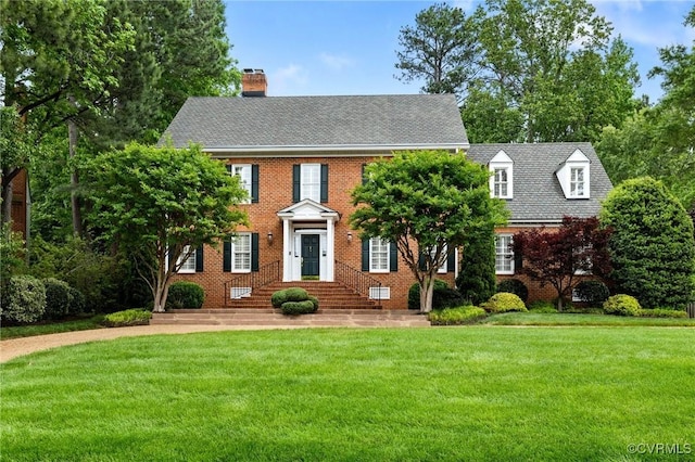 11458 Barrington Bridge Ct, Henrico, VA 23233 - view of front of property with a chimney, a front yard, and brick siding
