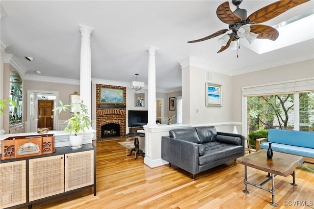 11458 Barrington Bridge Ct, Henrico, VA 23233 - living area featuring decorative columns, a ceiling fan, light wood finished floors, ornamental molding, and a brick fireplace
