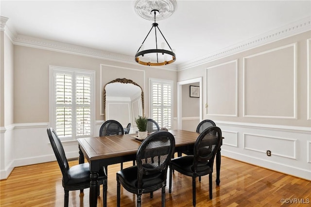 11458 Barrington Bridge Ct, Henrico, VA 23233 - dining room with a chandelier, light wood finished floors, and a decorative wall