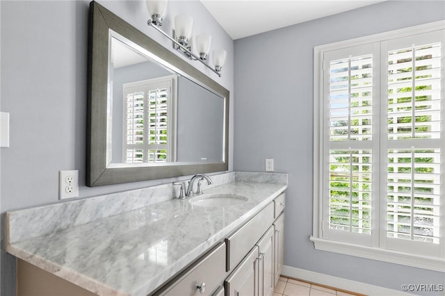 11458 Barrington Bridge Ct, Henrico, VA 23233 - bathroom with healthy amount of natural light, vanity, tile patterned flooring, and baseboards