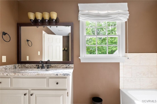 11458 Barrington Bridge Ct, Henrico, VA 23233 - bathroom featuring vanity, healthy amount of natural light, and a bathtub