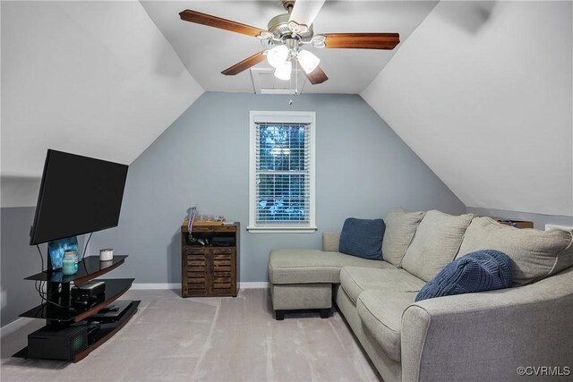 carpeted living room with ceiling fan, lofted ceiling, and baseboards