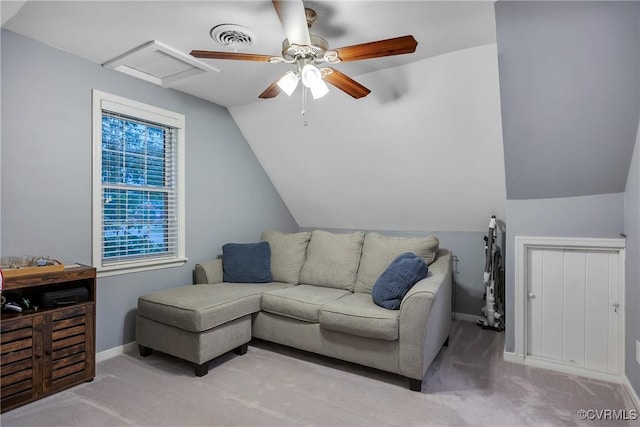 living area featuring light colored carpet, vaulted ceiling, ceiling fan, and baseboards