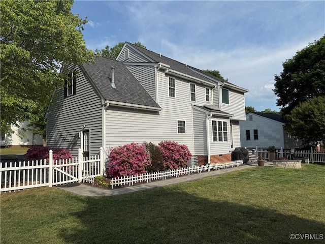 rear view of house featuring roof with shingles