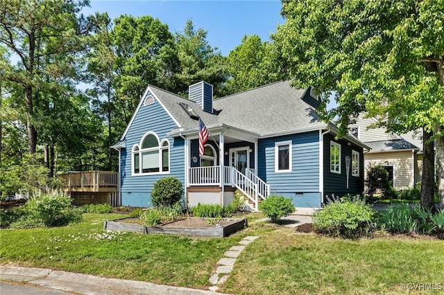 view of front of house with crawl space, a front lawn, a porch, and a chimney