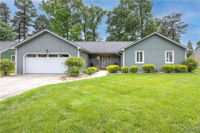 ranch-style home featuring a garage, driveway, a front yard, board and batten siding, and roof with shingles