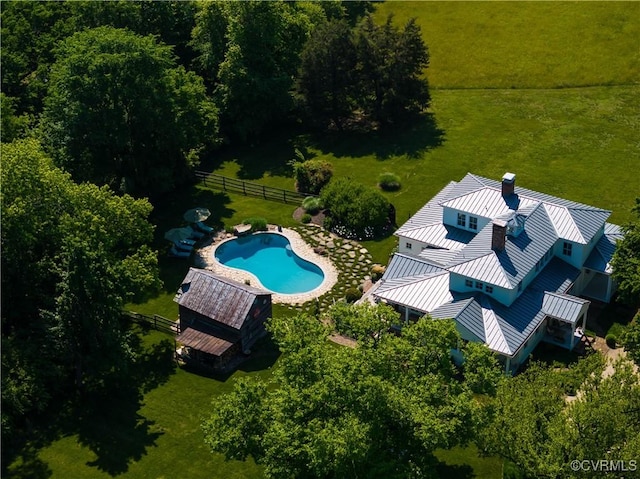 view of subject property featuring a pool