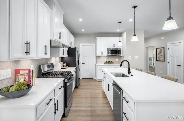 9 Abercrombie Dr, Chesterfield, VA 23838 - kitchen featuring stainless steel appliances, a sink, light wood-type flooring, recessed lighting, and tasteful backsplash