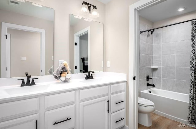 9 Abercrombie Dr, Chesterfield, VA 23838 - full bath featuring toilet, double vanity, wood finished floors, and shower / washtub combination