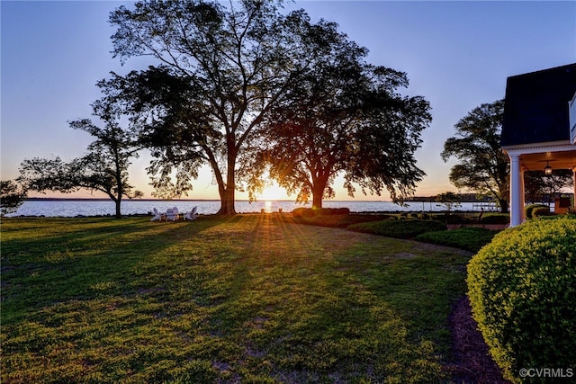 6454 Carmines Island Ln, Gloucester, VA 23072 - yard at dusk featuring a water view and a lawn