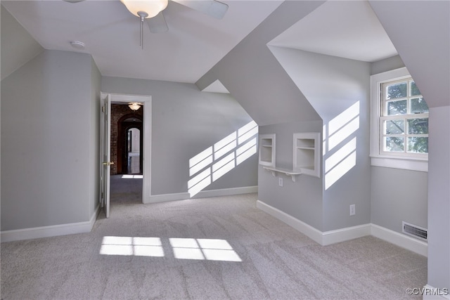 6454 Carmines Island Ln, Gloucester, VA 23072 - additional living space featuring carpet, ceiling fan, baseboards, and lofted ceiling