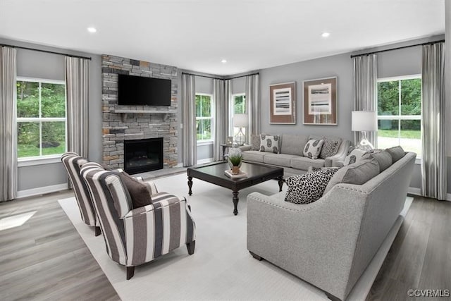13 Abercrombie Dr, Chesterfield, VA 23838 - living area with a stone fireplace, light wood finished floors, recessed lighting, and baseboards