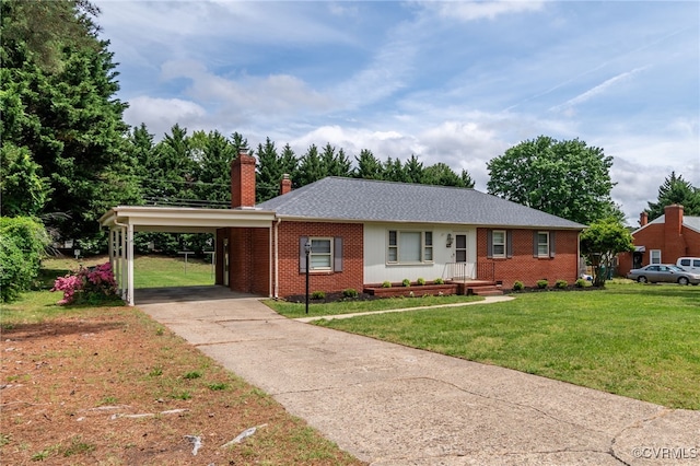 ranch-style house featuring brick siding, a chimney, a carport, and a front lawn