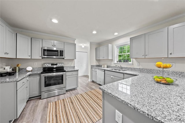 7570 Mount Zion Rd, Jetersville, VA 23083 - kitchen featuring appliances with stainless steel finishes, crown molding, gray cabinets, a sink, and light stone counters