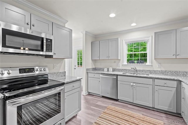 7570 Mount Zion Rd, Jetersville, VA 23083 - kitchen with stainless steel appliances, a sink, crown molding, light wood-type flooring, and gray cabinets