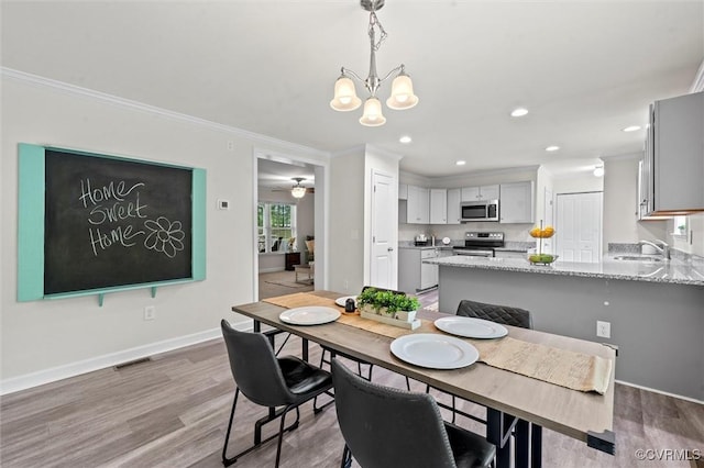 7570 Mount Zion Rd, Jetersville, VA 23083 - dining area featuring ornamental molding, wood finished floors, a chandelier, baseboards, and recessed lighting