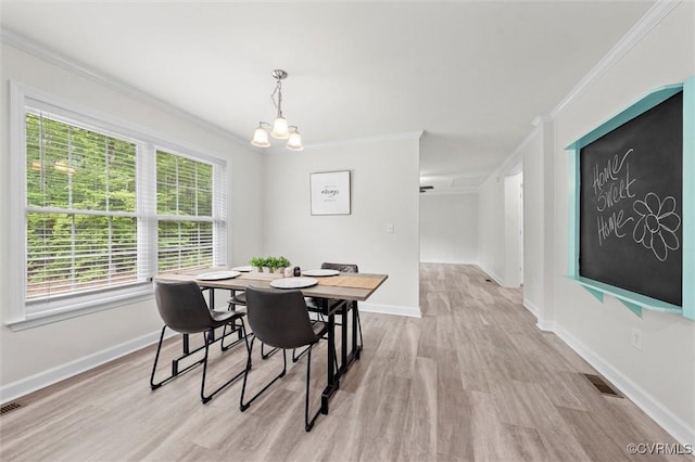 7570 Mount Zion Rd, Jetersville, VA 23083 - dining area featuring ornamental molding, a chandelier, plenty of natural light, light wood-style floors, and baseboards