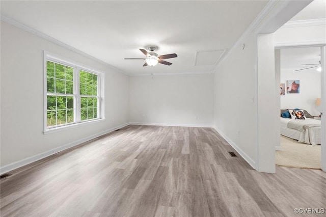 7570 Mount Zion Rd, Jetersville, VA 23083 - empty room with a ceiling fan, crown molding, wood finished floors, baseboards, and attic access