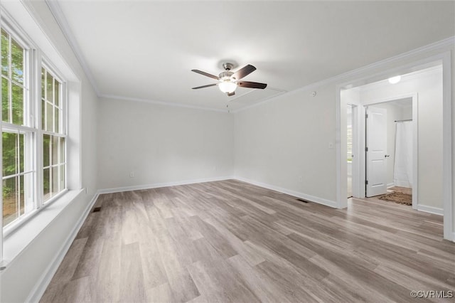 7570 Mount Zion Rd, Jetersville, VA 23083 - empty room featuring healthy amount of natural light, ceiling fan, wood finished floors, baseboards, and crown molding