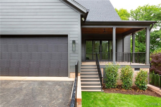 2005 Southcliff Rd, Richmond, VA 23225 - view of front of house with asphalt driveway, covered porch, an attached garage, and stairway