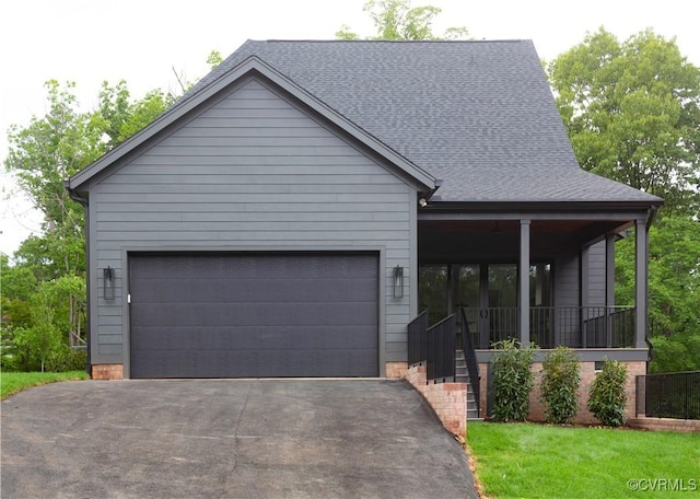 2005 Southcliff Rd, Richmond, VA 23225 - view of front of property with asphalt driveway, a garage, a shingled roof, a front yard, and covered porch