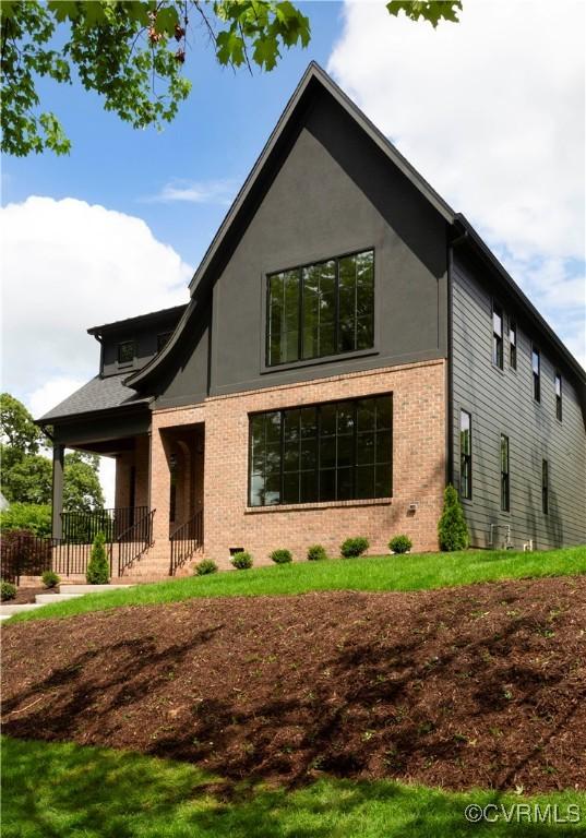 2005 Southcliff Rd, Richmond, VA 23225 - view of front facade featuring brick siding and a porch