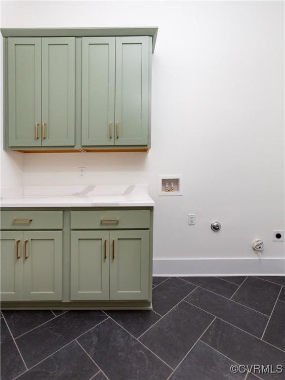 2005 Southcliff Rd, Richmond, VA 23225 - laundry area with cabinet space, baseboards, hookup for a gas dryer, washer hookup, and hookup for an electric dryer
