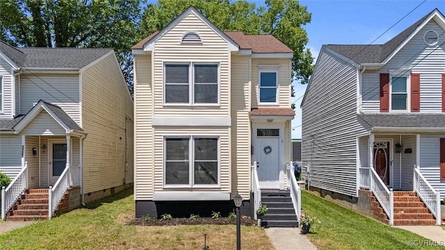 1725 Porter St, Richmond, VA 23224 - traditional-style house featuring entry steps, a front yard, and crawl space