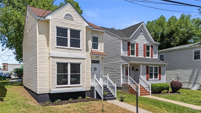 1725 Porter St, Richmond, VA 23224 - traditional-style house featuring a front lawn