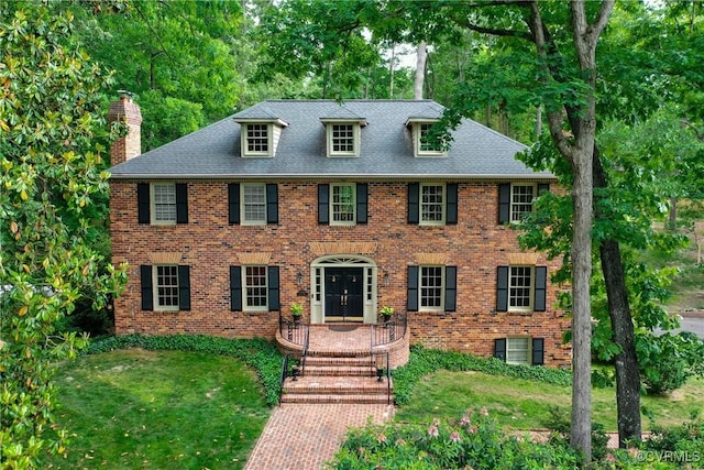 4709 Perdue St, Chester, VA 23831 - colonial inspired home featuring a chimney, brick siding, and a shingled roof