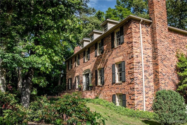 4709 Perdue St, Chester, VA 23831 - view of side of home featuring brick siding and a chimney