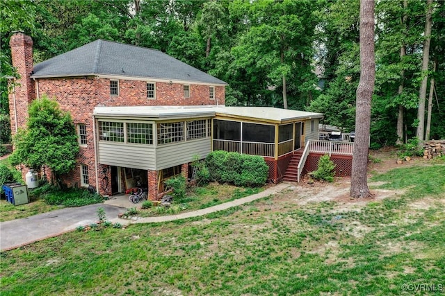 4709 Perdue St, Chester, VA 23831 - rear view of house with a sunroom, stairway, a chimney, a carport, and asphalt driveway