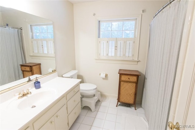 4709 Perdue St, Chester, VA 23831 - full bath with toilet, vanity, tile patterned floors, and baseboards