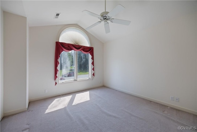 unfurnished room featuring carpet floors, lofted ceiling, ceiling fan, and baseboards