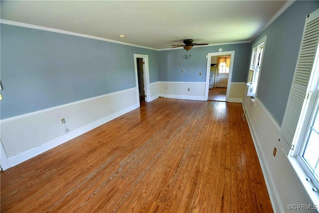 612 S Broad St, Kenbridge, VA 23944 - empty room featuring ceiling fan, healthy amount of natural light, wood finished floors, crown molding, and baseboards