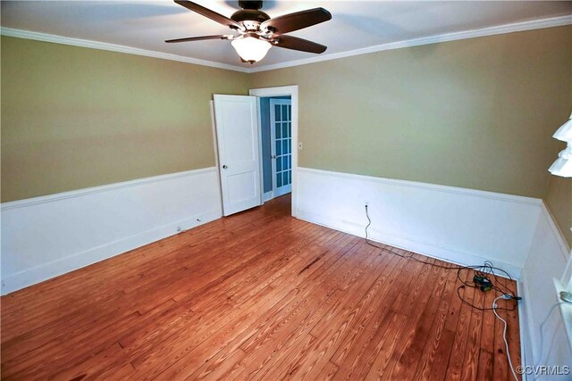 612 S Broad St, Kenbridge, VA 23944 - empty room with wood finished floors, a ceiling fan, and ornamental molding
