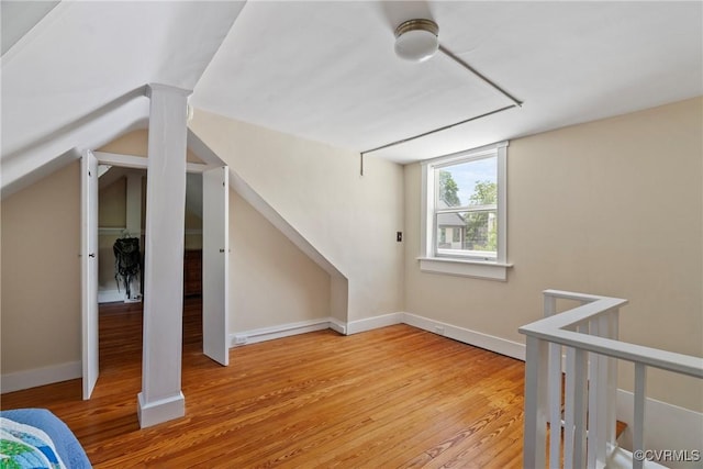 3201 Kensington Ave, Richmond, VA 23221 - additional living space with light wood-style floors, vaulted ceiling, and baseboards