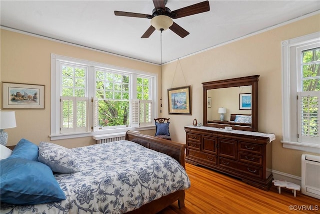 3201 Kensington Ave, Richmond, VA 23221 - bedroom featuring ornamental molding, light wood-style floors, ceiling fan, and baseboards