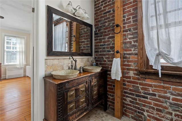 3201 Kensington Ave, Richmond, VA 23221 - bathroom featuring ornamental molding, wood finished floors, and double vanity