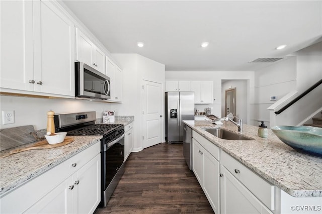 7006 Sanguine Mews, Chesterfield, VA 23234 - kitchen featuring appliances with stainless steel finishes, a sink, dark wood-type flooring, white cabinets, and recessed lighting